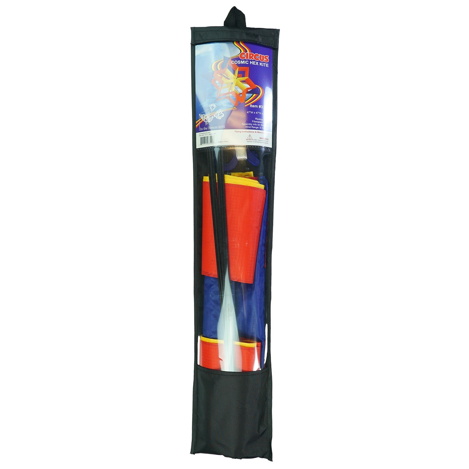 Circus Cosmic Hex Kite in bright colors soaring through a blue sky with clouds, showcasing its unique hexagonal design.