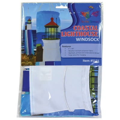 Coastal Lighthouse 40-inch windsock with vibrant lighthouse design and tails hanging elegantly from a garden in a coastal setting.
