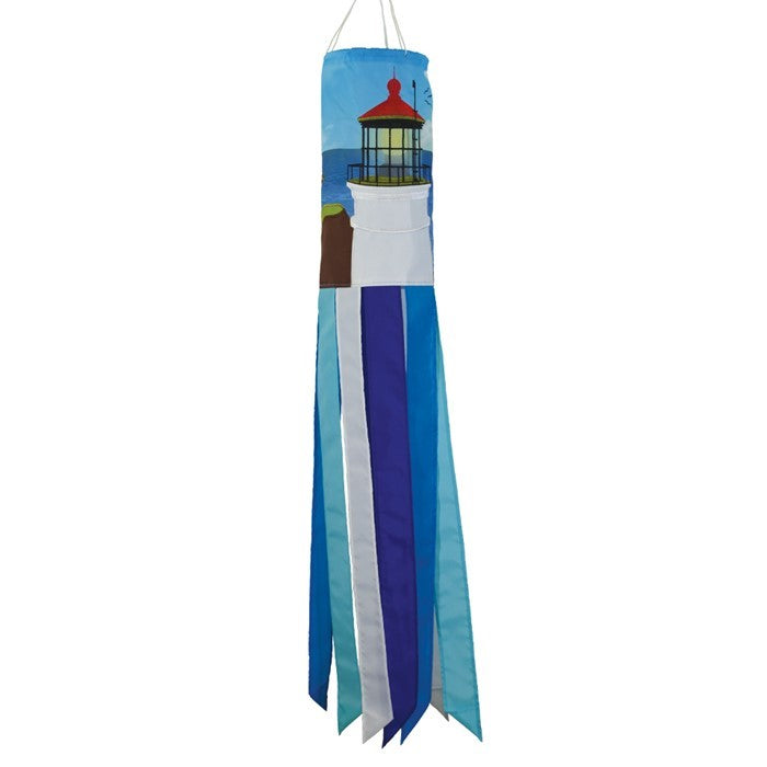 Coastal Lighthouse 40-inch windsock with vibrant lighthouse design and tails hanging elegantly from a garden in a coastal setting.