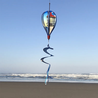 Coastal Lighthouse 6-Panel Hot Air Balloon spinner in vibrant colors with a lighthouse design hanging in a garden setting, spinning in the breeze.