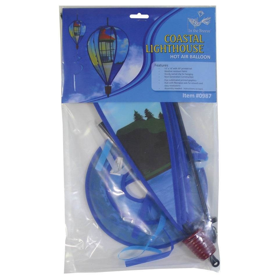 Coastal Lighthouse 6-Panel Hot Air Balloon spinner in vibrant colors with a lighthouse design hanging in a garden setting, spinning in the breeze.