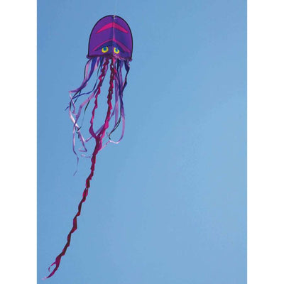 Cool Jellyfish Kite with vibrant colors and long tails drifting high in the sky during a sunny day at the beach.