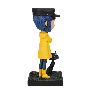 6.5 inch Coraline and The Cat Bobblehead featuring Coraline in a yellow raincoat with a cat, beautifully detailed, and made of premium resin.