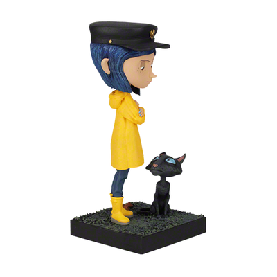 6.5 inch Coraline and The Cat Bobblehead featuring Coraline in a yellow raincoat with a cat, beautifully detailed, and made of premium resin.