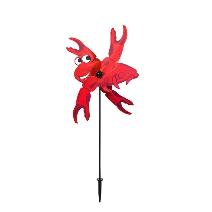 Crab Baby Whirligig garden decoration with vibrant crab design featuring spinning claws, displayed outdoors in a garden setting.