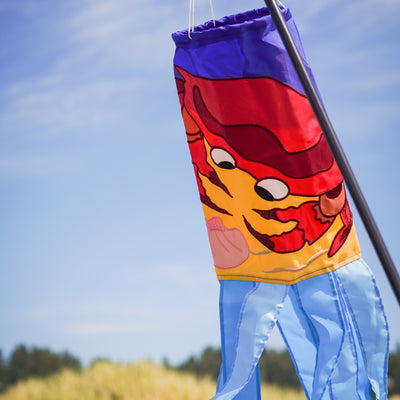 A colorful Crab Shell 40" Windsock featuring an animated crab design with vibrant tails, crafted from durable weather-resistant polyester for outdoor display.