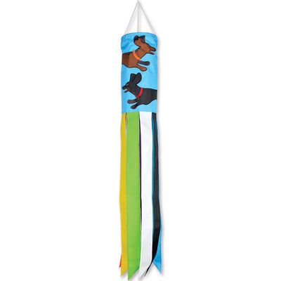 Colorful Dachshund windsock displayed outdoors, fluttering in the breeze, showcasing the charming design of the breed.