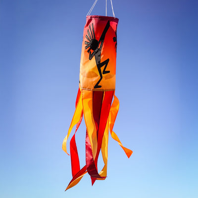 Dancing Kokopelli windsock featuring intricate graphics and vibrant colors, gracefully fluttering with the wind and enhancing any outdoor decor.