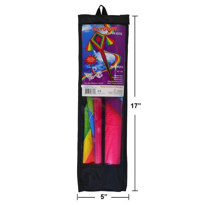Dayglow 45-inch Fly-Hi Kite in bright rainbow colors flying high against a clear sky with two colorful streamer tails.