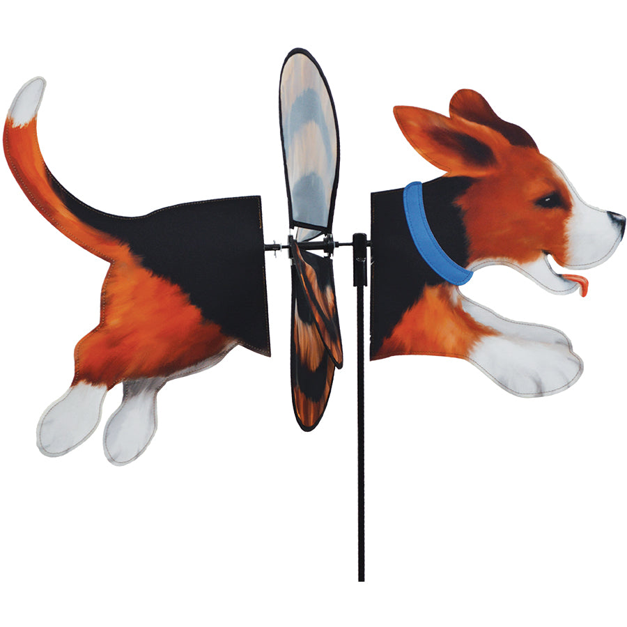 Deluxe Petite Spinner featuring a Beagle design, elegantly spinning in a garden surrounded by flowers under clear blue skies.