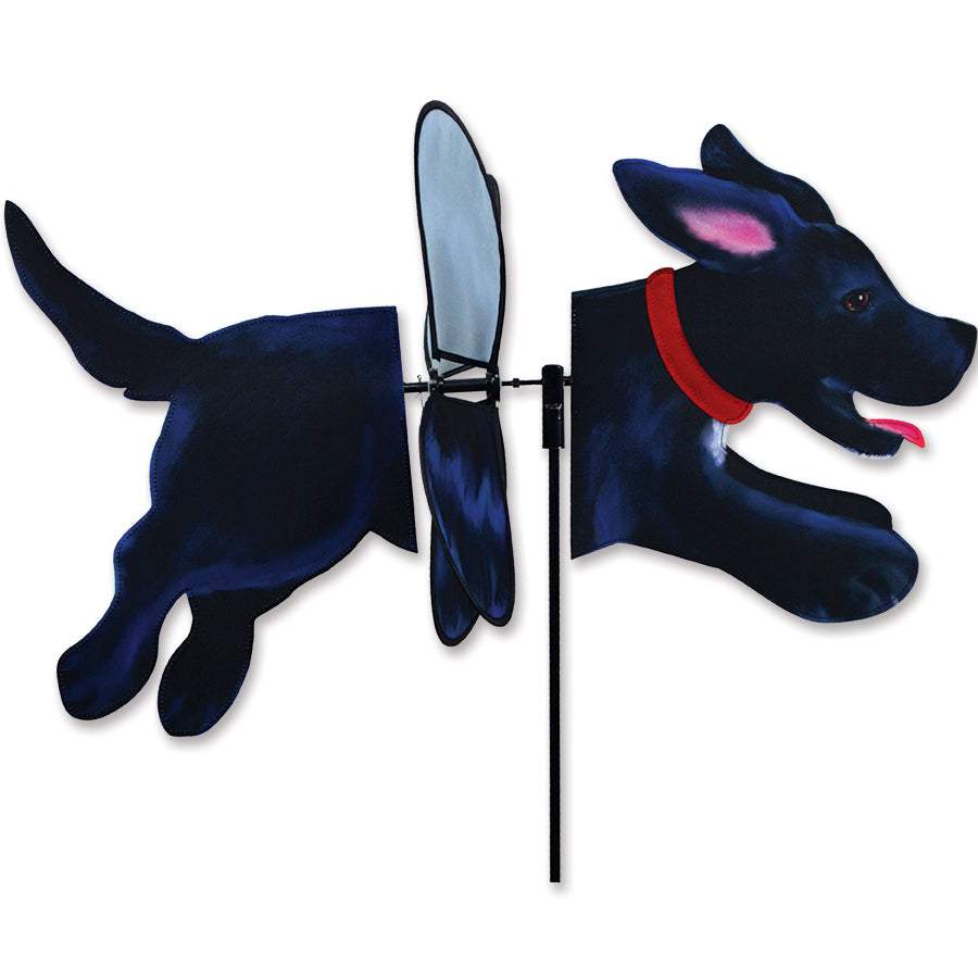 Deluxe Petite Spinner featuring a Black Lab design, showcasing its vibrant colors and propeller spinning in a gentle breeze in a garden setting.