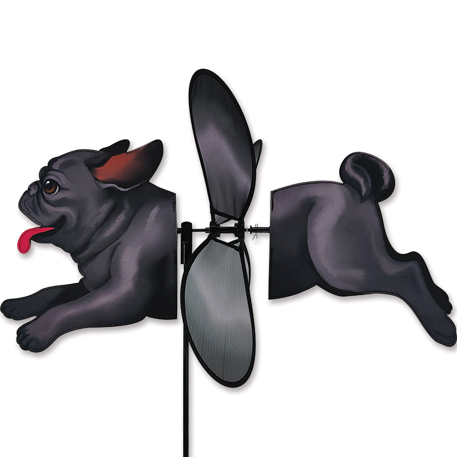 Deluxe Petite Spinner - Black Pug, a charming garden spinner with a black pug design spinning gracefully in a gentle breeze amidst flowers.