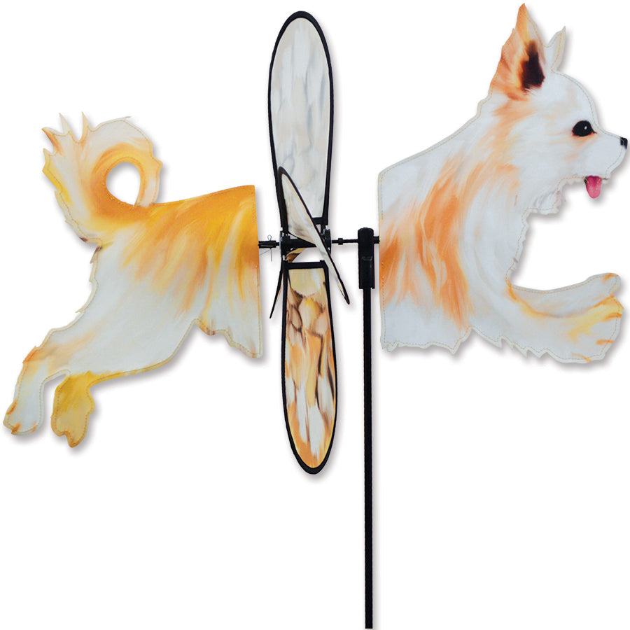 Deluxe Petite Spinner featuring a Chihuahua design, spinning in a garden environment, displaying vibrant colors against green foliage.