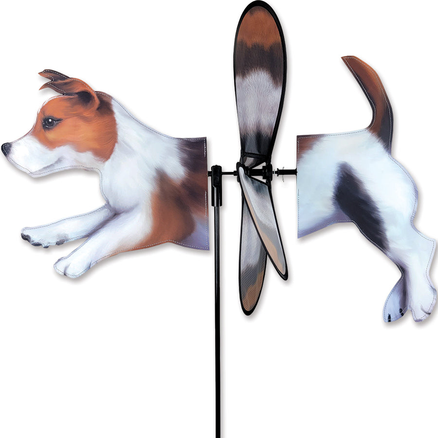 Deluxe Petite Spinner featuring a Jack Russell Terrier design, spinning in a gentle breeze, displayed in a colorful garden setting.