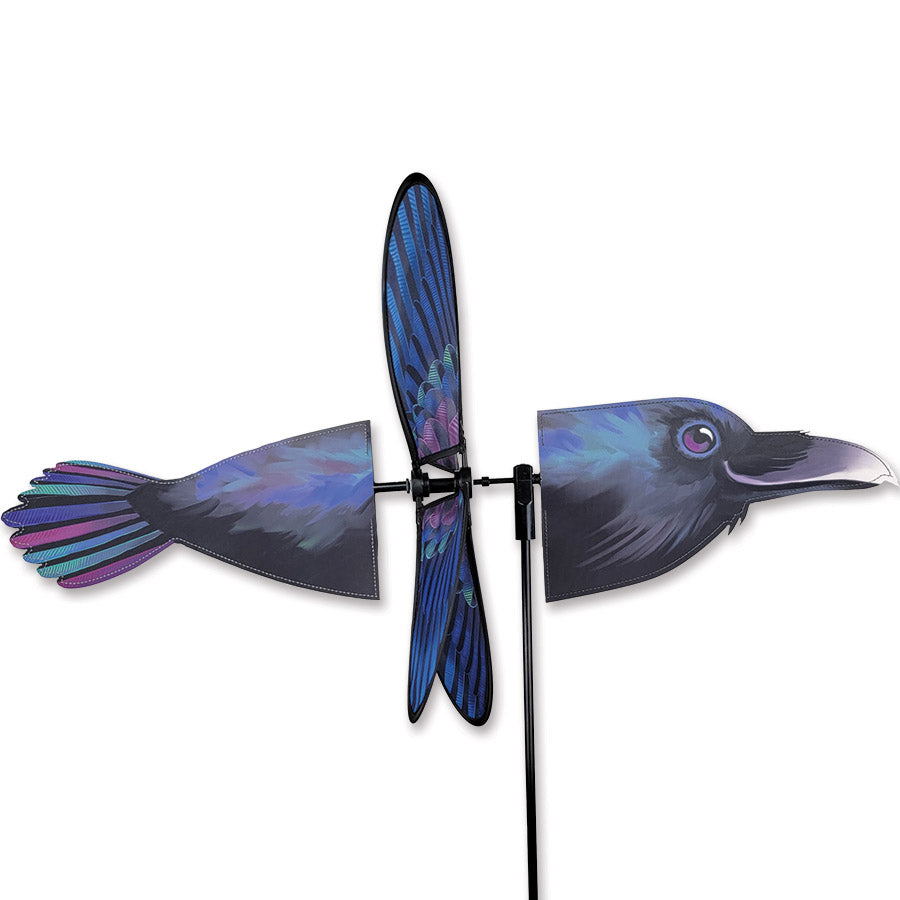 The Deluxe Petite Spinner in Raven is a charming garden decoration with a captivating design that effortlessly spins in the breeze, enhancing outdoor spaces.