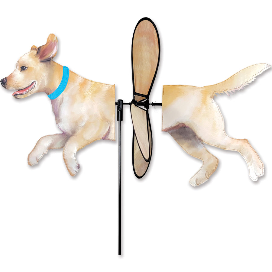 Deluxe Petite Spinner featuring a charming yellow lab design, gracefully spinning in a garden setting with a bright landscape in the background.
