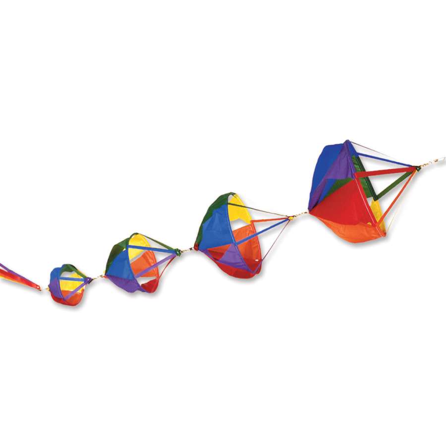 Deluxe Spinnie Set - Rainbow featuring colorful Spinnies with matching streamer tails displayed outdoors, spinning gracefully in the breeze.
