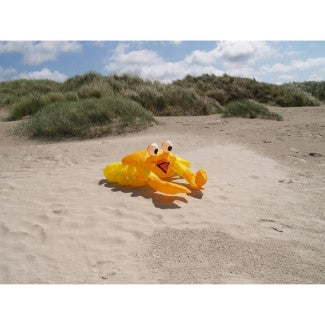 Compact bouncing crab kite accessory in bright orange designed to hop and move in stronger breezes for playful beach and lawn displays.