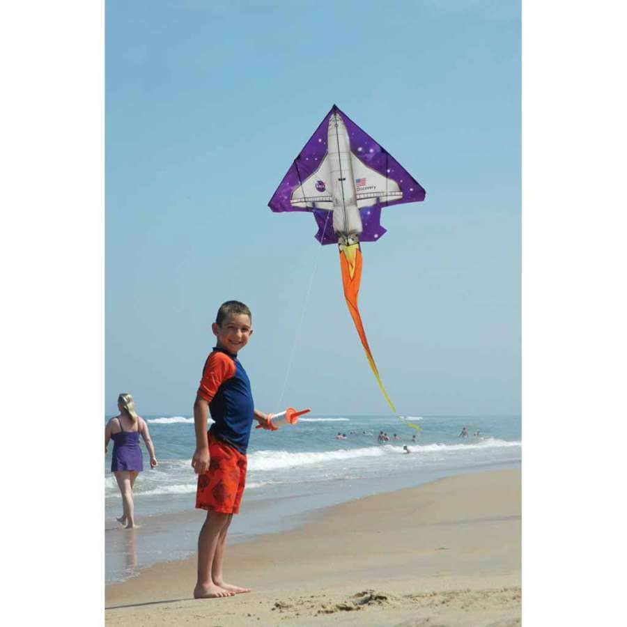 2D Space Shuttle kite with tall rocket profile, ripstop fabric, fiberglass frame, and 300 ft. of 50 lb. test line. Fabric case with color header included.