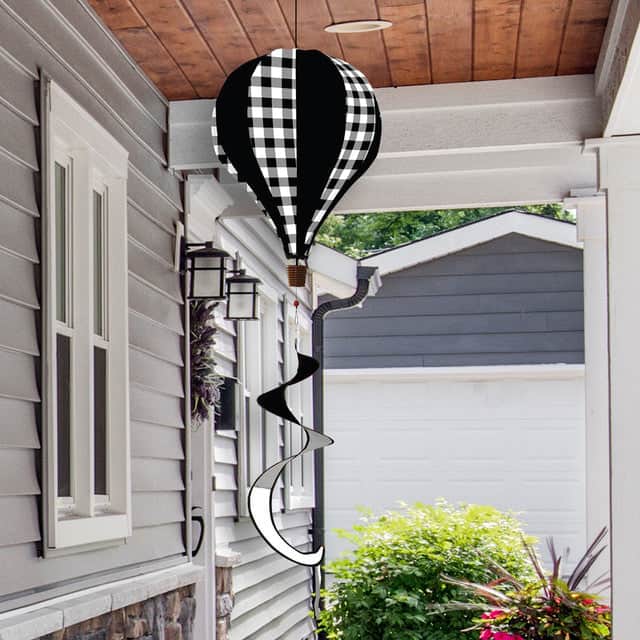Farmhouse-style hot air balloon spinner with burlap-look polyester, buffalo plaid design, and durable spinning motion for classic outdoor décor.