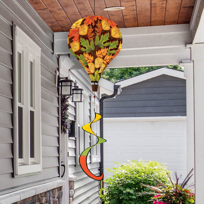 Hot air balloon spinner with colorful autumn leaves design, made of weather-resistant polyester for breezy, festive fall garden or porch décor.