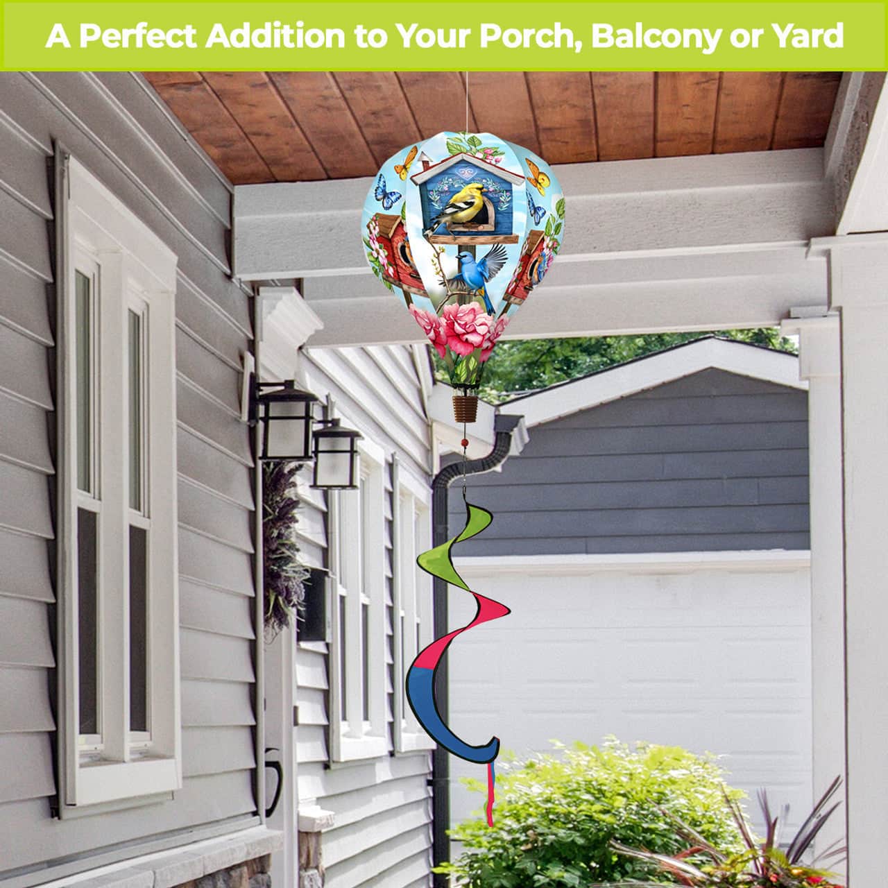 Hot air balloon spinner with blooming flowers, songbirds, and a birdhouse design, made of weather-resistant polyester for cheerful garden or patio décor.