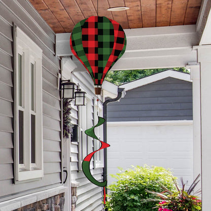 Holiday hot air balloon spinner with buffalo check plaid in red and green, durable polyester build, and elegant winter motion for outdoor seasonal decorating.