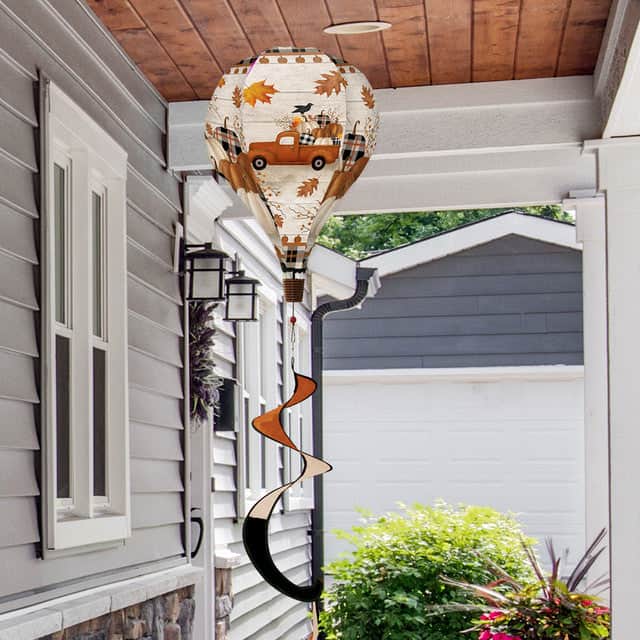 Hot air balloon spinner with vintage pickup truck, pumpkins, and fall florals, made of weather-resistant polyester for breezy, festive autumn outdoor décor.