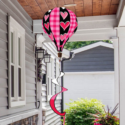 Valentine’s hot air balloon spinner with heart patterns, durable polyester, and romantic spinning design for festive garden or porch decoration.