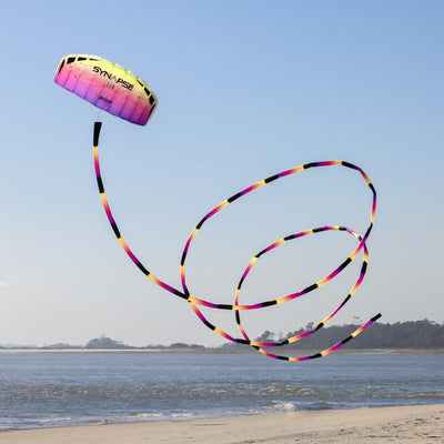 Plasma tube tail with yellow, pink, and purple gradient design, inflating airflow construction, and swivel clip for dynamic kite displays.