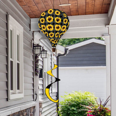 Sunflower-themed hot air balloon spinner with bright yellow petals, weather-resistant fabric, and flowing tail for cheerful outdoor seasonal decoration.