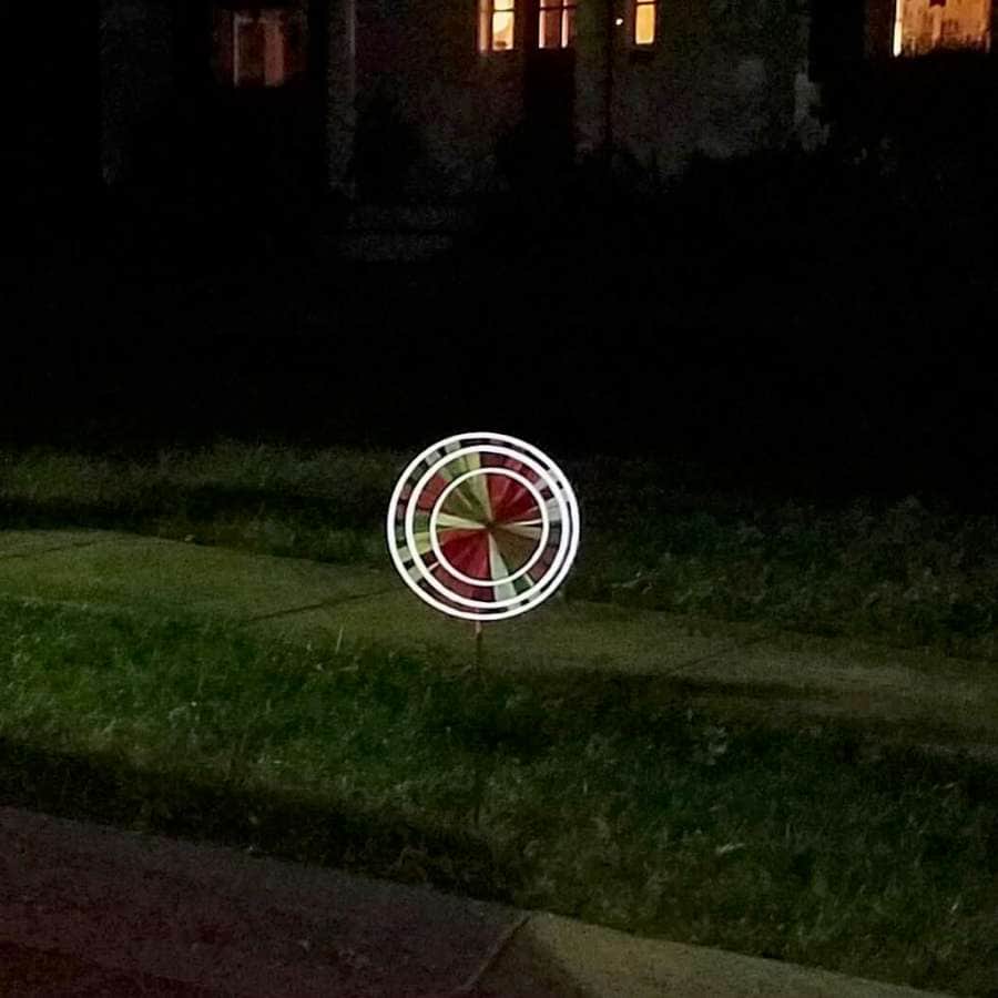 Reflective triple spinner with layered wheels, fade-resistant SunTex™ fabric, and light-catching accents—perfect for bright daytime color and glowing nighttime effect.