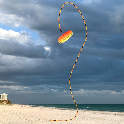 Infrared tube tail with red, orange, and yellow gradient, inflating tubular construction, and swivel clip for dynamic kite motion and visibility.