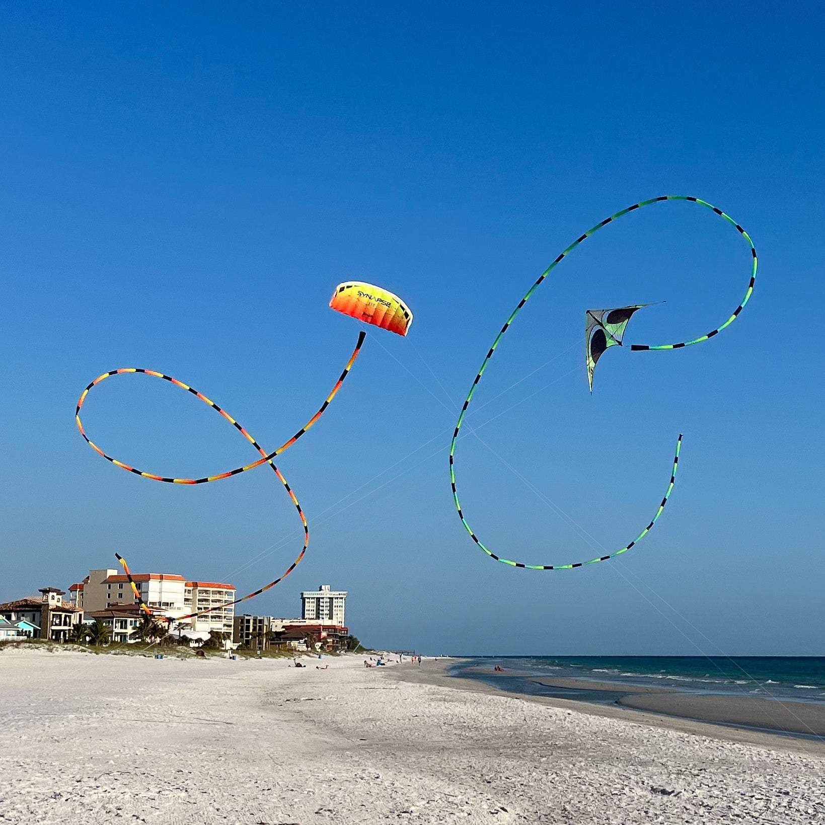 Prism Aurora tube tail with geometric gradient design, inflating tubular construction, and swivel clip for dynamic, flowing kite displays.
