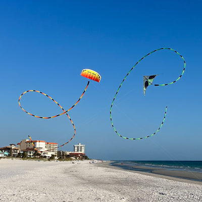Prism Aurora tube tail with geometric gradient design, inflating tubular construction, and swivel clip for dynamic, flowing kite displays.