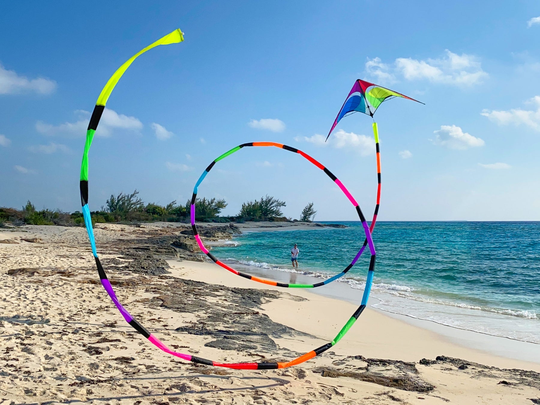 Spectrum tube tail with rainbow gradient, inflating airflow construction, and swivel clip attachment for vibrant, motion-filled kite flying.