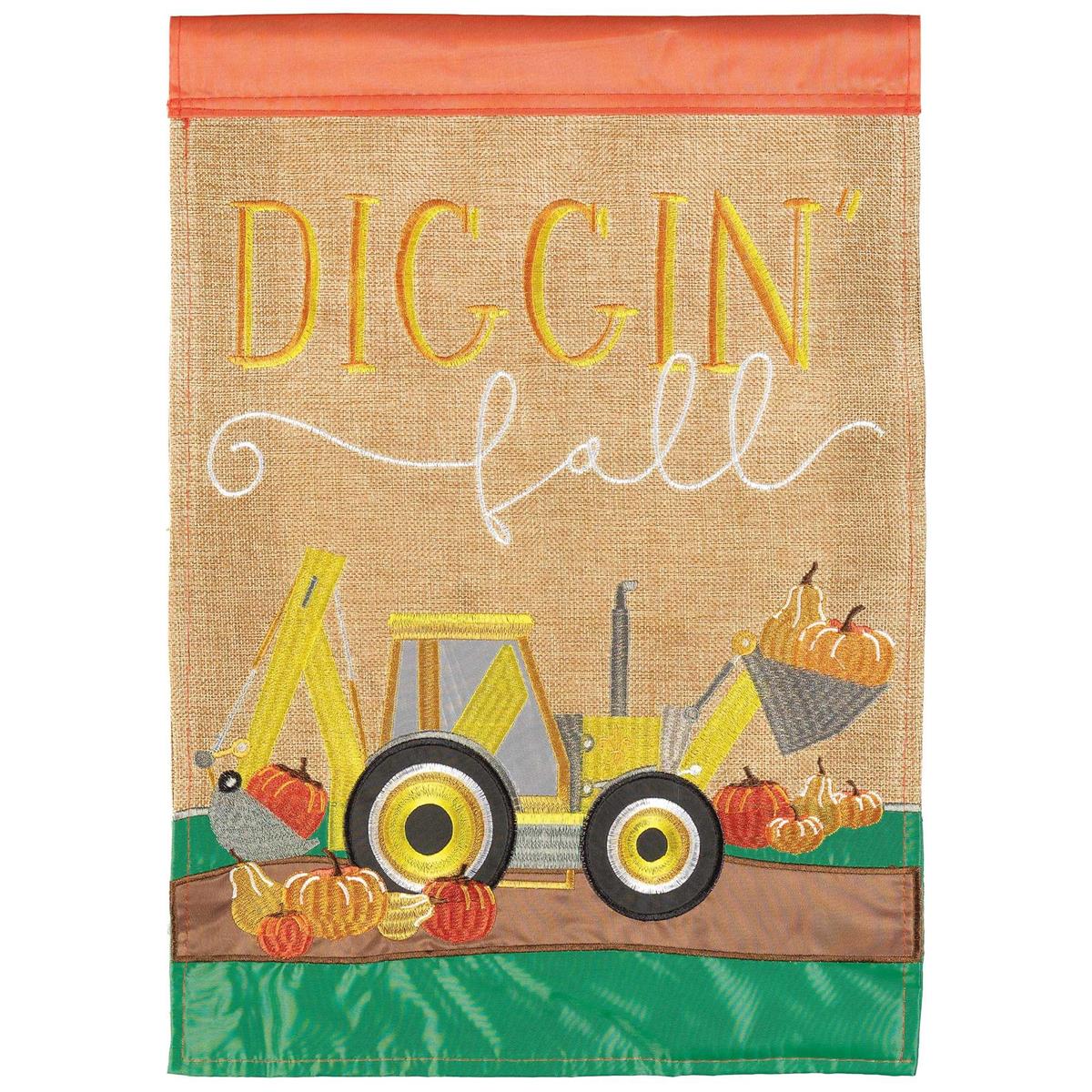 Diggin Fall Backhoe burlap garden flag featuring a playful backhoe design surrounded by autumn leaves, displayed in a garden setting.