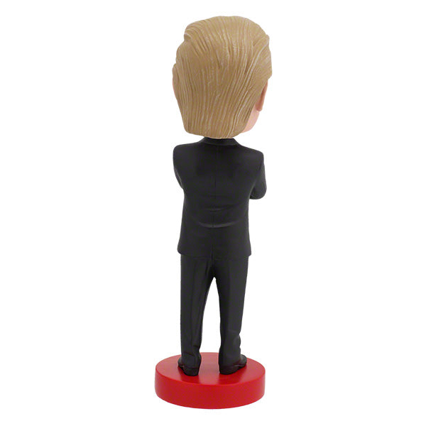 Donald Trump bobblehead over 8 inches tall, featuring an intricate design and hand-painted details, perfect for collectors and supporters.