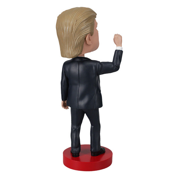 Donald Trump 'Fight!' bobblehead, 7-inch collectible displaying a detailed figure of Trump, showcasing vibrant colors and quality craftsmanship.