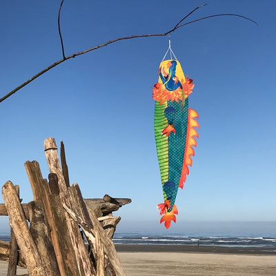 Colorful Dragon 50 inch 3D Windsock flying in the wind, showcasing vibrant dragon design in an outdoor garden setting.