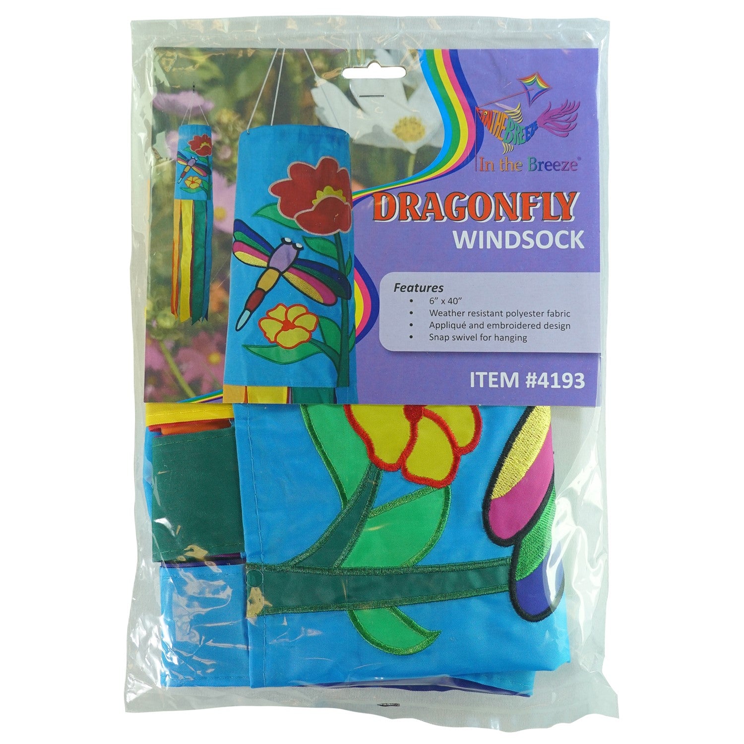 A colorful Dragonfly 40\" Windsock with appliqued graphics and fluttering tails displayed in a garden, showcasing its whimsical design.