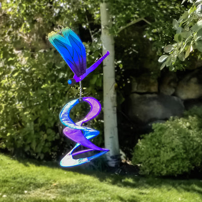 The Dragonfly Theme Duet features a vibrant, multi-colored design with spinning dragonflies that sway and move, creating visual interest in outdoor settings.