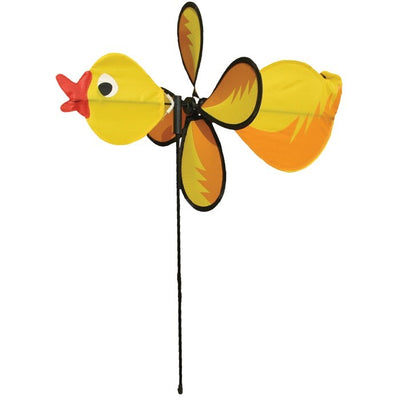 Duck Baby Spinner with bright colors and a 12-inch wheel displaying in a garden, featuring a baby duck design and fiberglass pole.