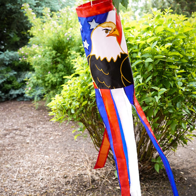Eagle 40-inch windsock displaying vibrant red, white, and blue colors with applique design and coordinating tails fluttering in the breeze.