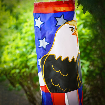 Eagle 40-inch windsock displaying vibrant red, white, and blue colors with applique design and coordinating tails fluttering in the breeze.