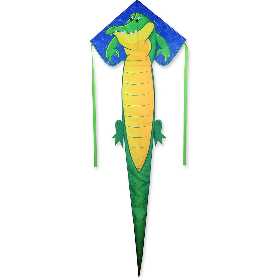 Easy Flyer Kite - Alligator measuring 30x90 inches with colorful alligator design, flying high against a blue sky in a park setting.