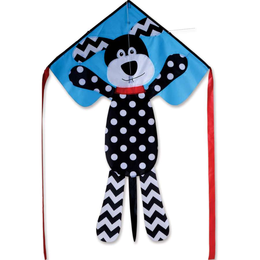 Easy Flyer Kite - Pattern Puppy featuring a colorful puppy design, measuring 30 x 90 inches, flying in a clear blue sky.