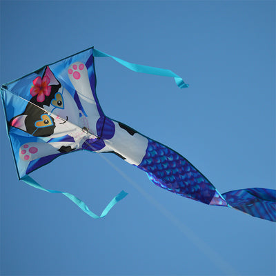 The Easy Flyer Kite - Purrmaid features vibrant colors and appliques, measuring 30 x 90 inches, soaring high against a clear sky.