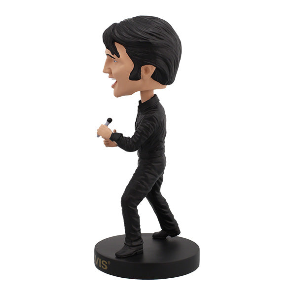 Elvis Presley '68 Comeback Special Bobblehead in black leather outfit, expertly hand-painted, displayed on a shelf against a colorful background.