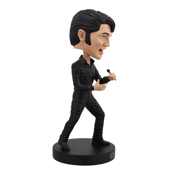 Elvis Presley '68 Comeback Special Bobblehead in black leather outfit, expertly hand-painted, displayed on a shelf against a colorful background.